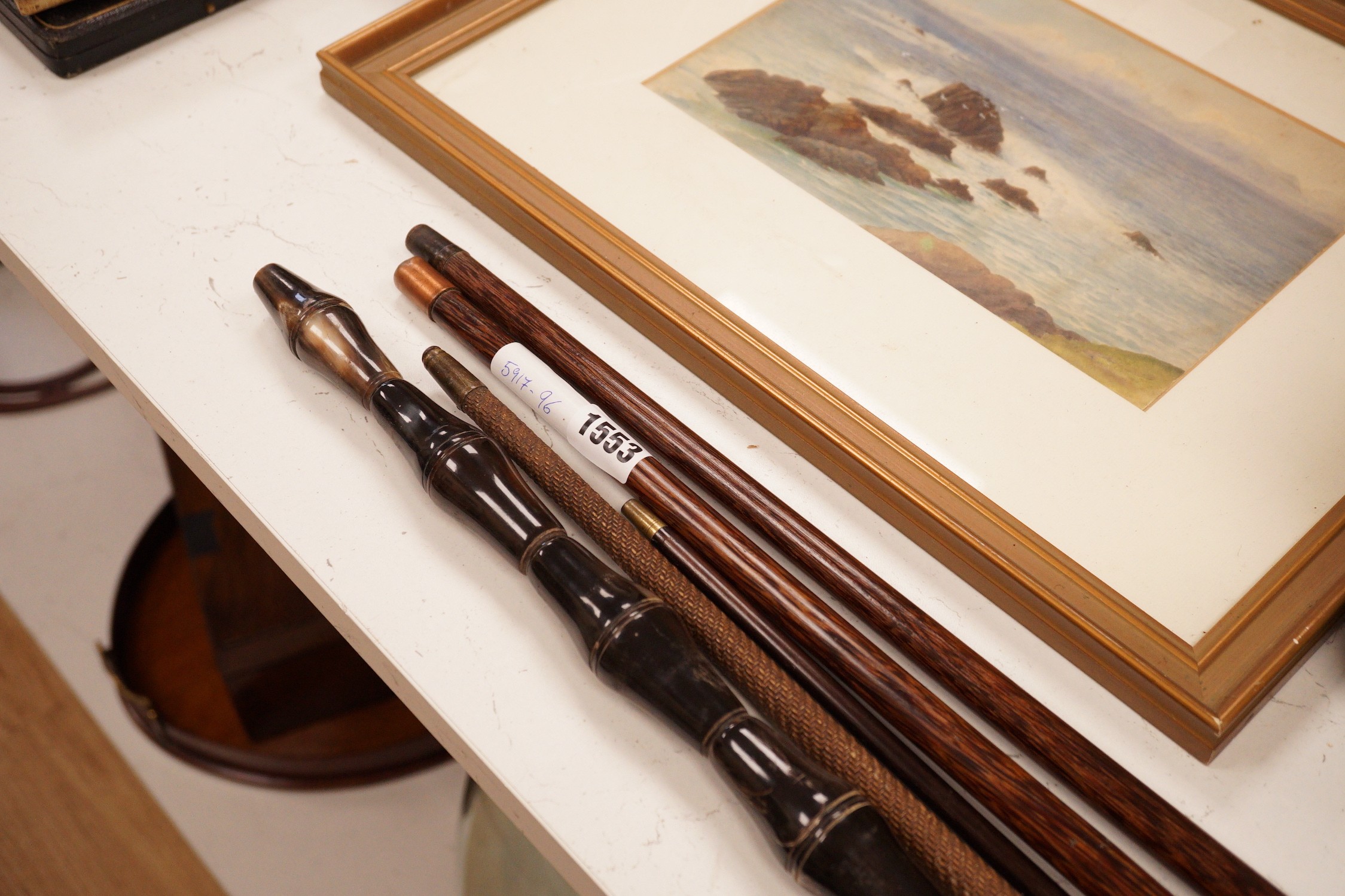Five assorted walking canes / to include an amboyna example, a sectional horn example, two silver topped etc.